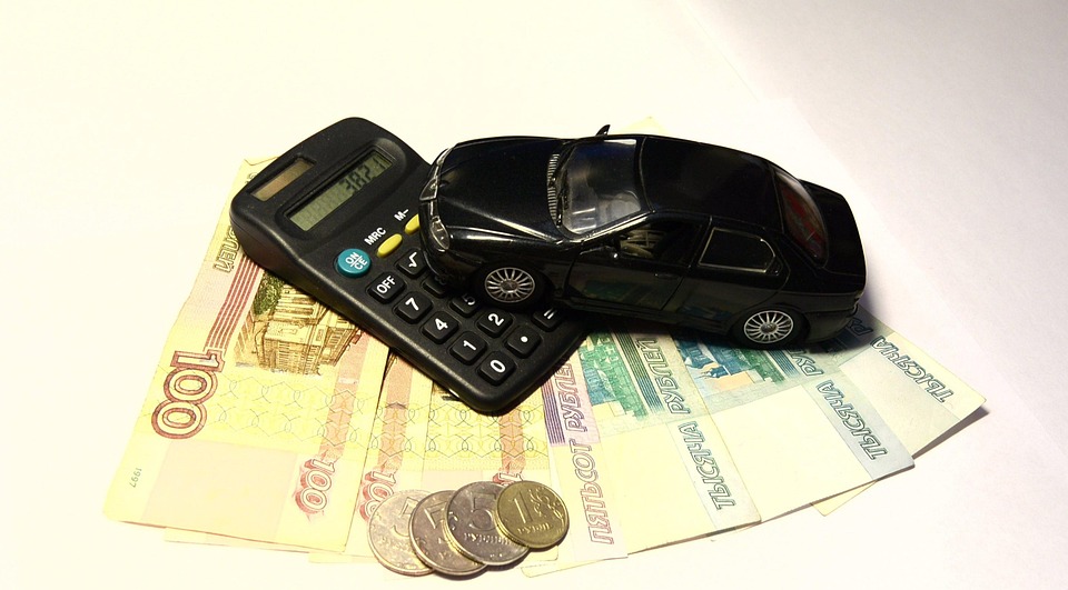 How to save money for car Coins, cash , black calculator and car showing