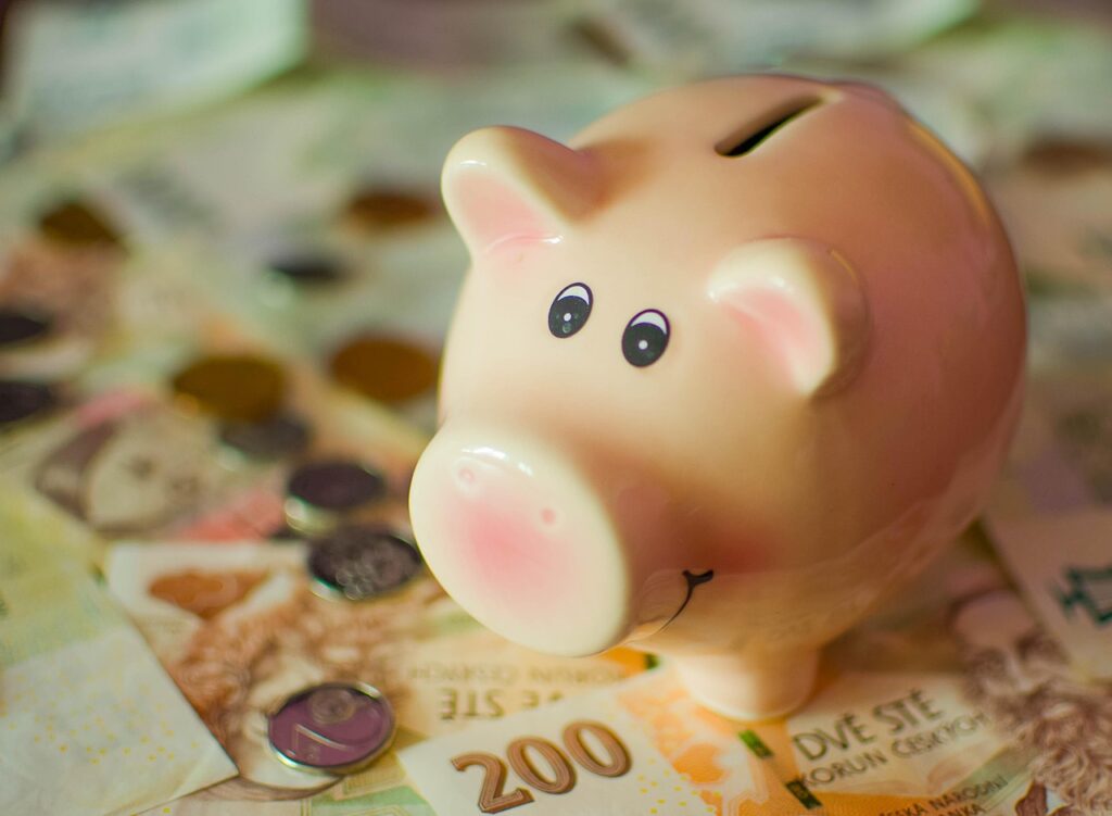 Saving Account A piggy bank, cash and coins are showing