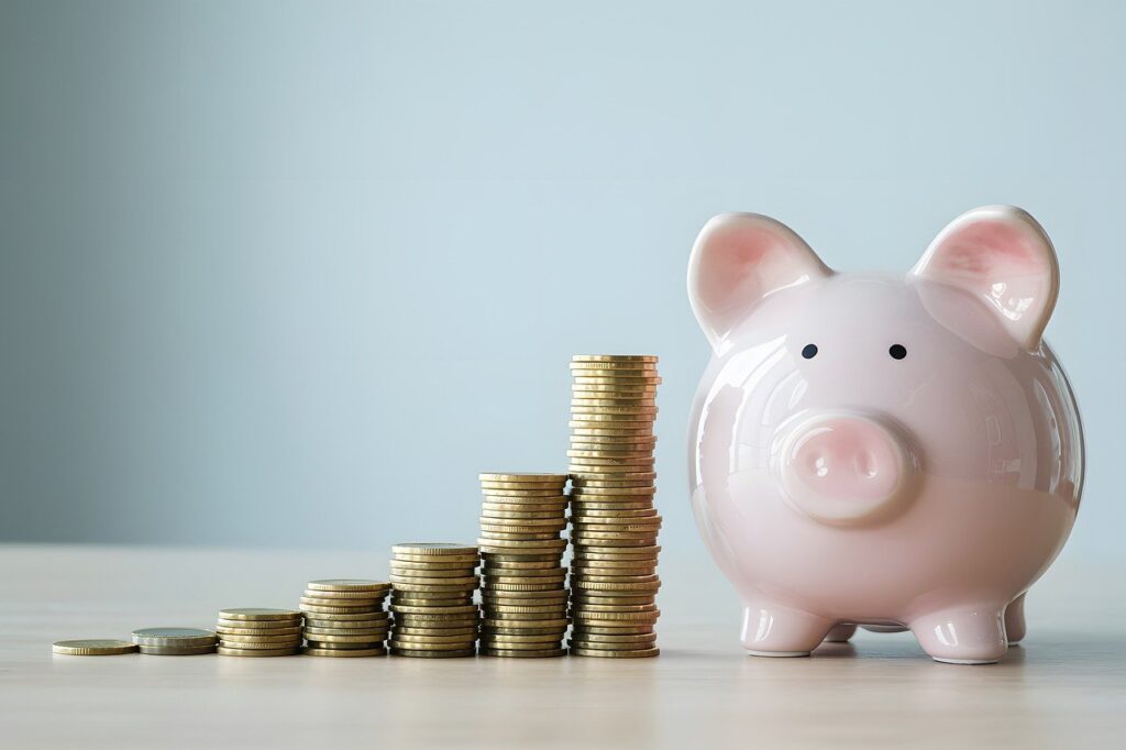 Saving Money Some coins are arranged in ascending order and white piggy bank showing